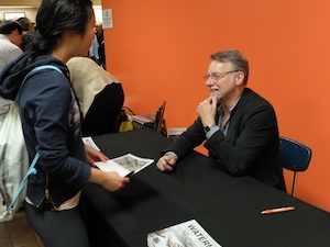 Edward Burtynsky speaks with a fan at Langara