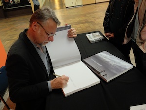 Edward Burtynksy signs his new book at Langara